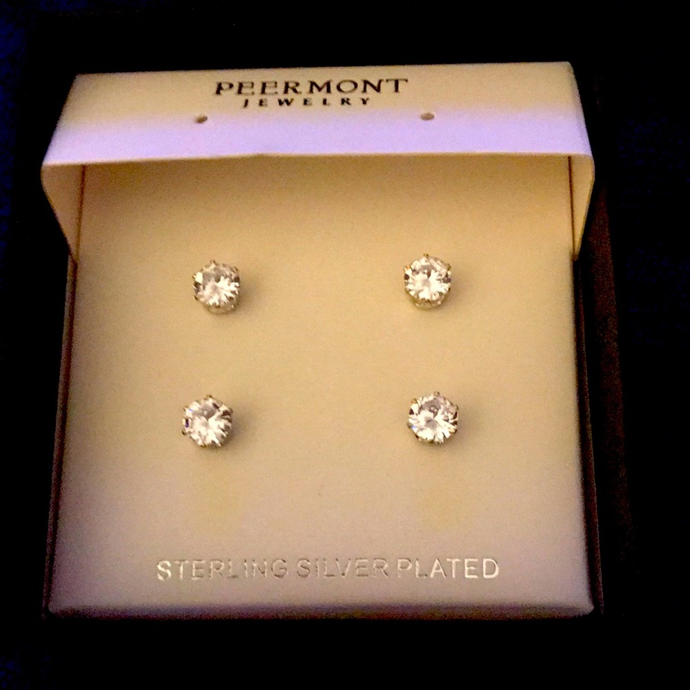 Pretty sterling silver plated studs .